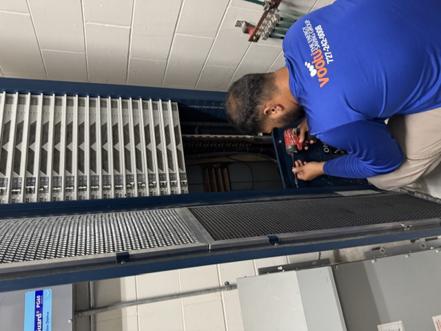 Vootu technician replacing an auditorium theatrical lighting dimmer rack